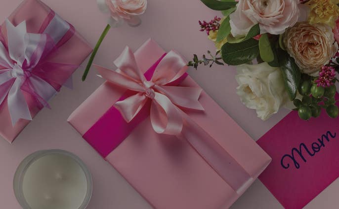 Mother's Day gift box with flowers and a candle 
