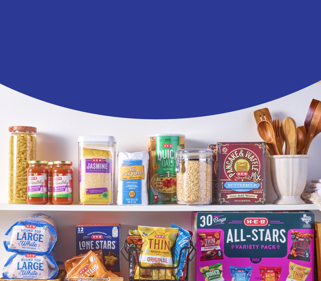 Shelves full of H‑E‑B brand products 