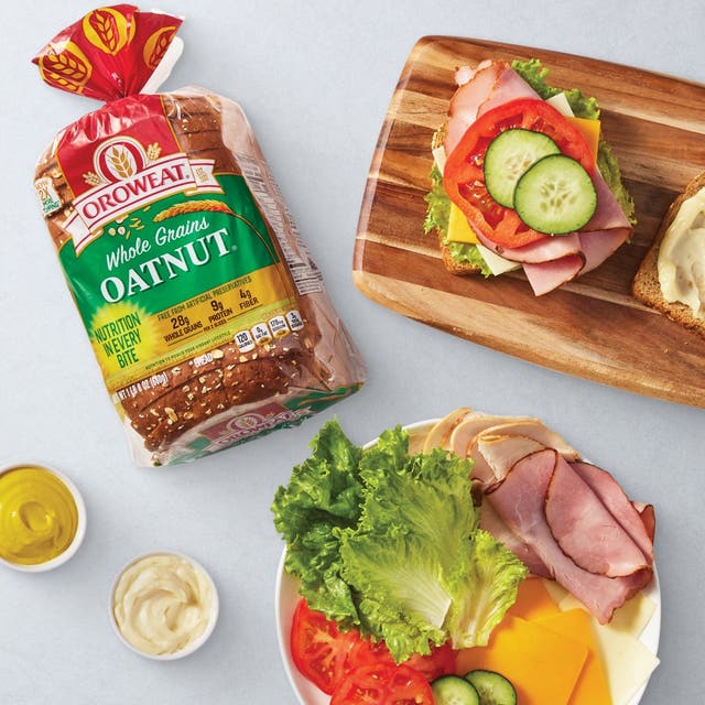 Oroweat oatnut brad sandwich with ham, cheese, lettuce, tomato and cheese