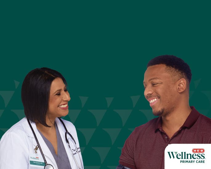 Physician providing a health screening for a patient