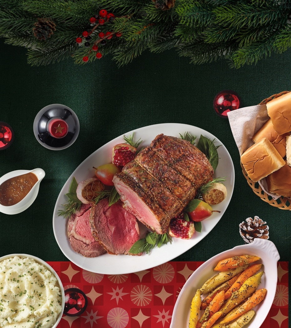 A spread of plates all throughout the table celebrating Christmas