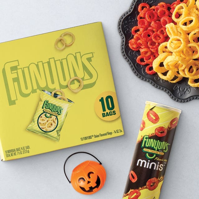 Halloween-themed Funyuns assortment with 10 bags, Flamin' Hot Minis can, plate of Funyuns, and pumpkin bucket.