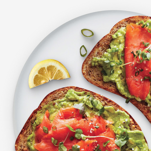 Avocado toast with smoked salmon and microgreens on top