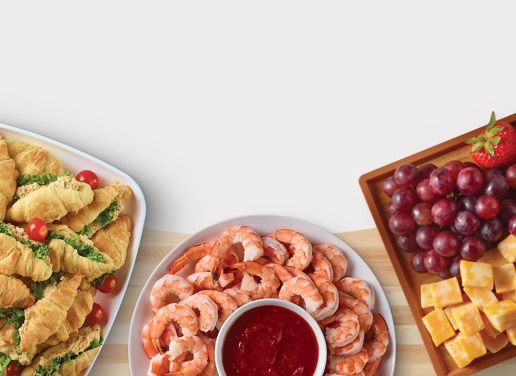 Croissant sandwiches party tray, grapes and cheese board, shrimp party tray