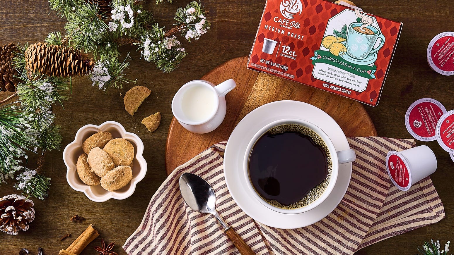 H‑E‑B Holiday Cafe Ole coffee poured into a cup with bakery treats on a plate