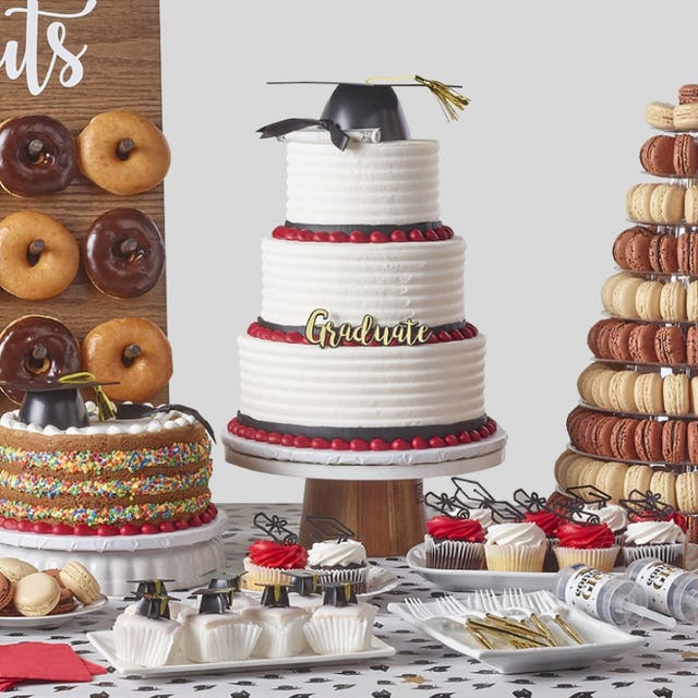 Cakes, donuts, cupcakes, and other treats for a graduation party
