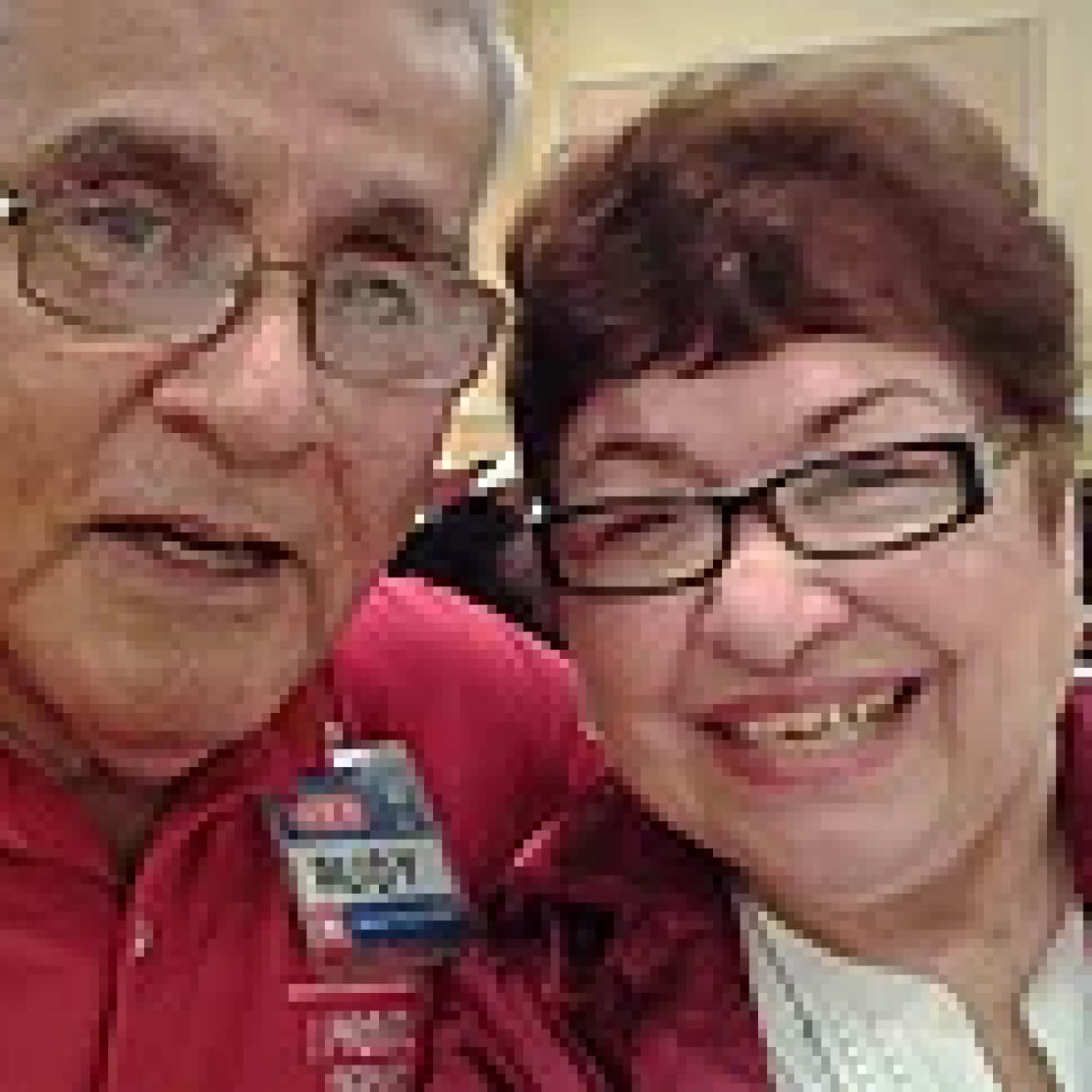 Two senior partners smiling