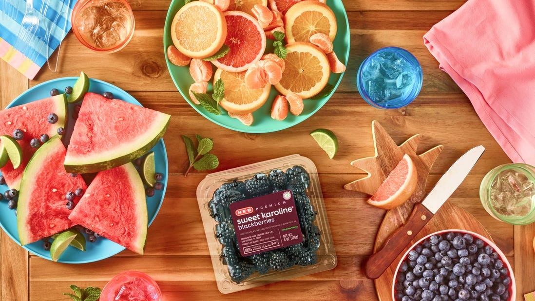 Cut watermelon ,oranges, blueberries & blackberries