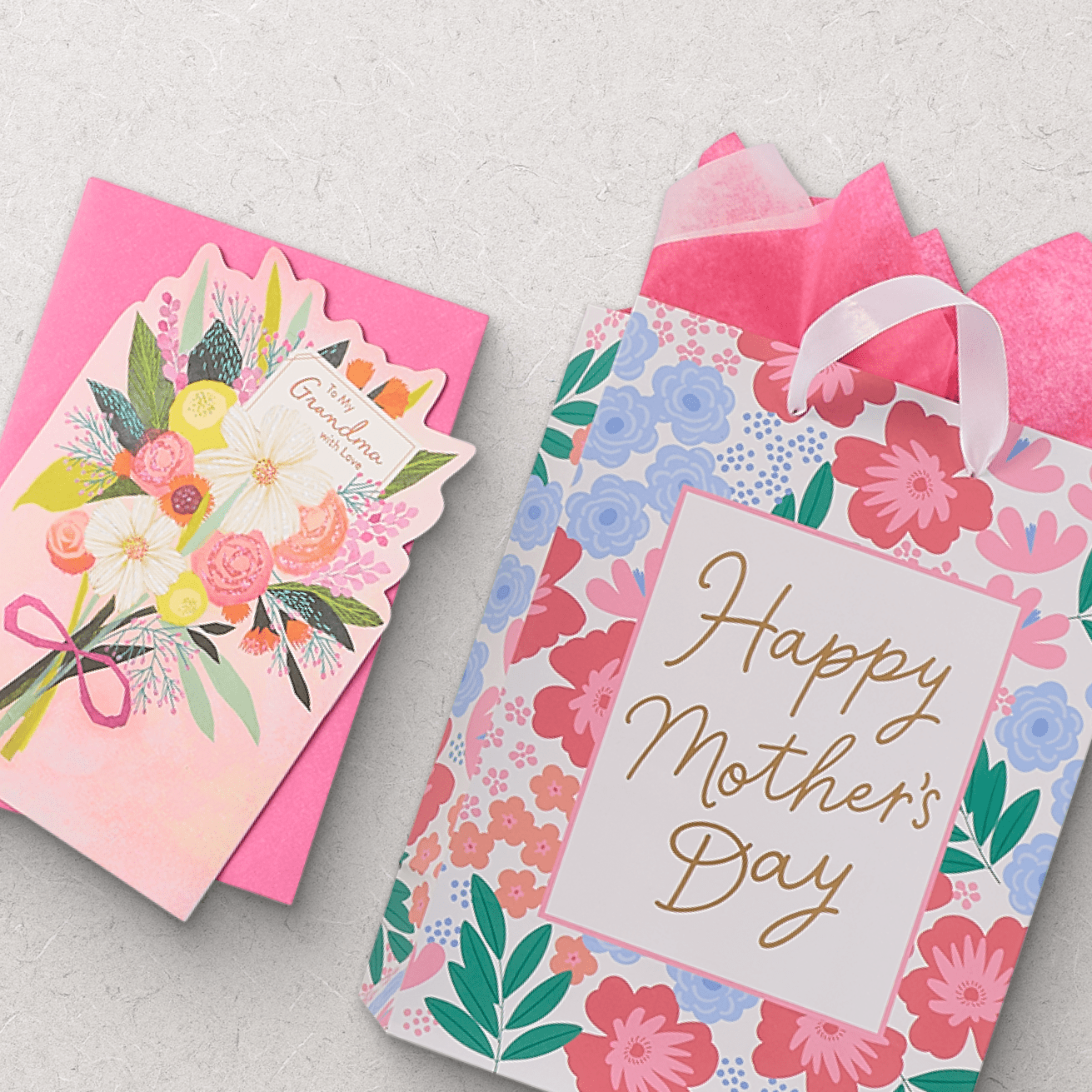 Colorful Mother's Day gift bag with floral design and 'Happy Mother's Day' message, accompanied by a pink greeting card featuring a bouquet illustration.
