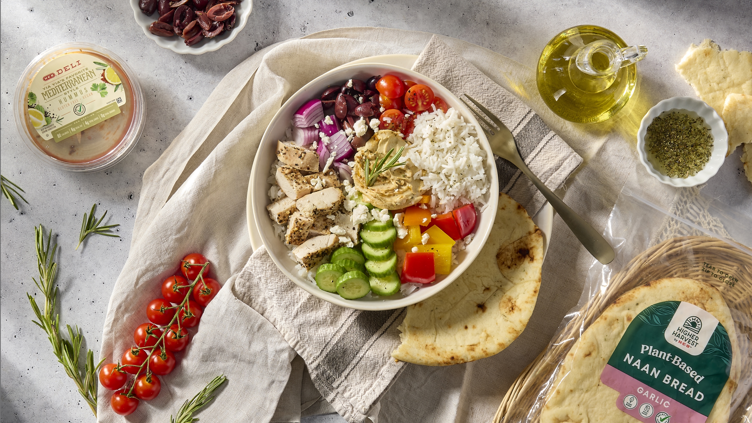 Lunch bowl with a spread around it on a counter top