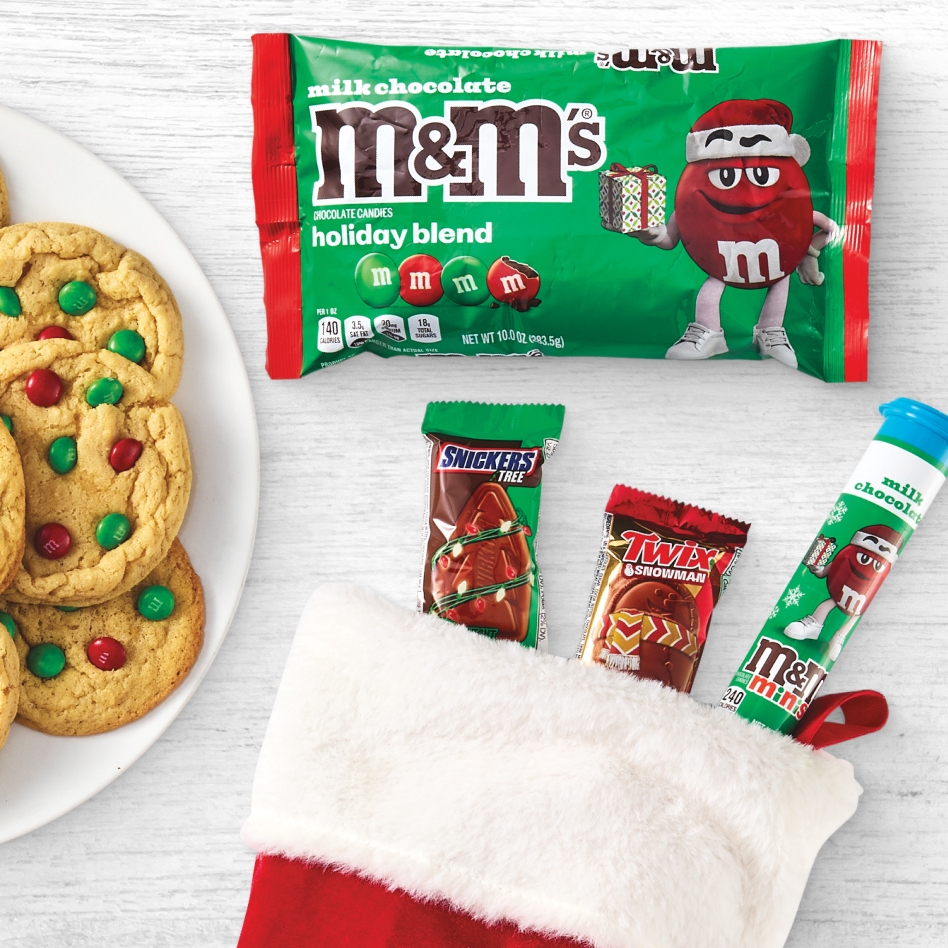 M&M's candy next to a plate of cookies