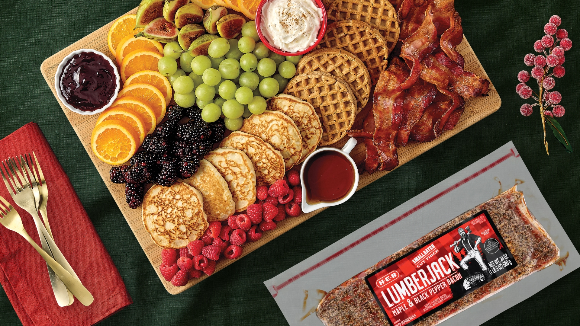 A spread of breakfast essentials such as pancakes, bacon, & fruit