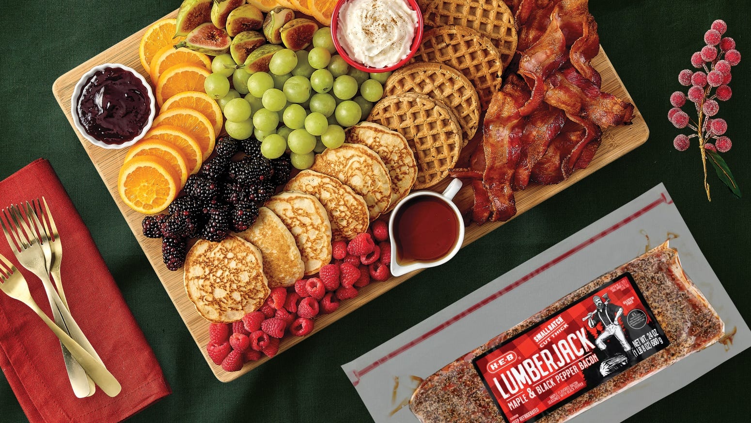 A spread of breakfast essentials such as pancakes, bacon, & fruit