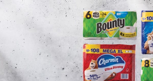 Up to $9 off paper items* Various packages of Bounty paper towels and Charmin toilet paper on a light gray background.