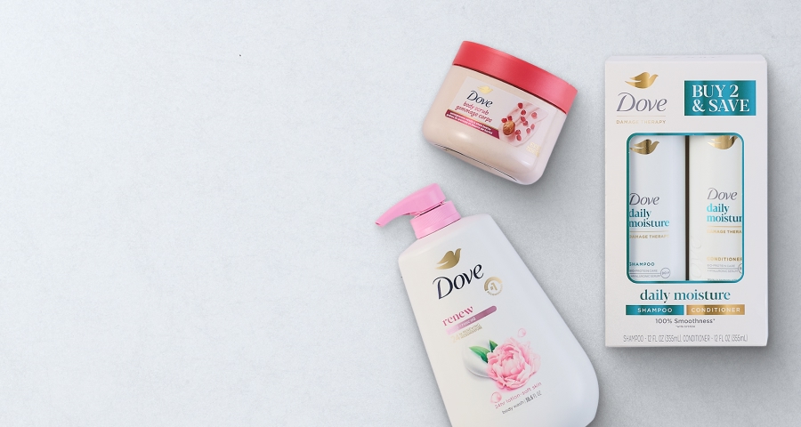 Dove hair and body care products including a shampoo and conditioner set, body lotion, and body cream on a light background.