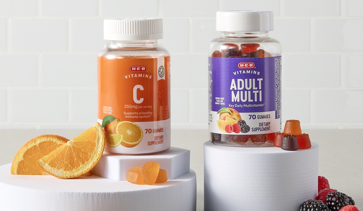 Bottles of H‑E‑B Vitamin C and Adult Multi vitamins 