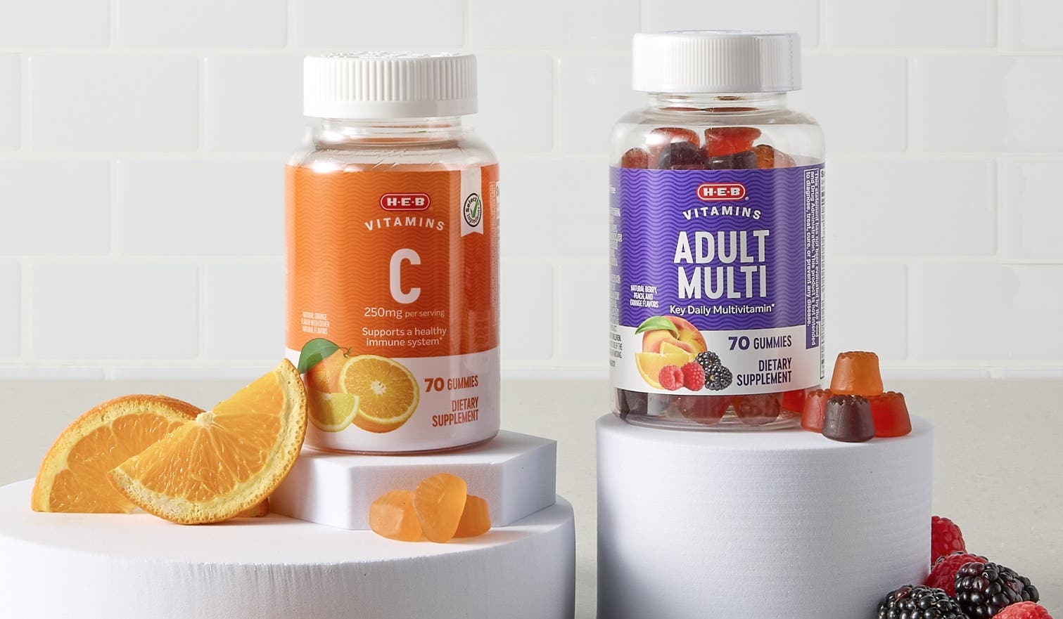 Bottles of H‑E‑B Vitamin C and Adult Multi vitamins