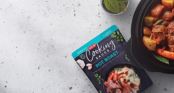 Slow cooker meals H‑E‑B Cooking Sauce for Pot Roast alongside a freshly cooked pot roast in a black pot.